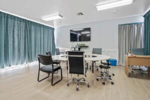 The rehab gym with chairs and tables for speech therapy at the Kennedy Care facility