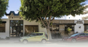 the front of the Kennedy Care facility, with green trees